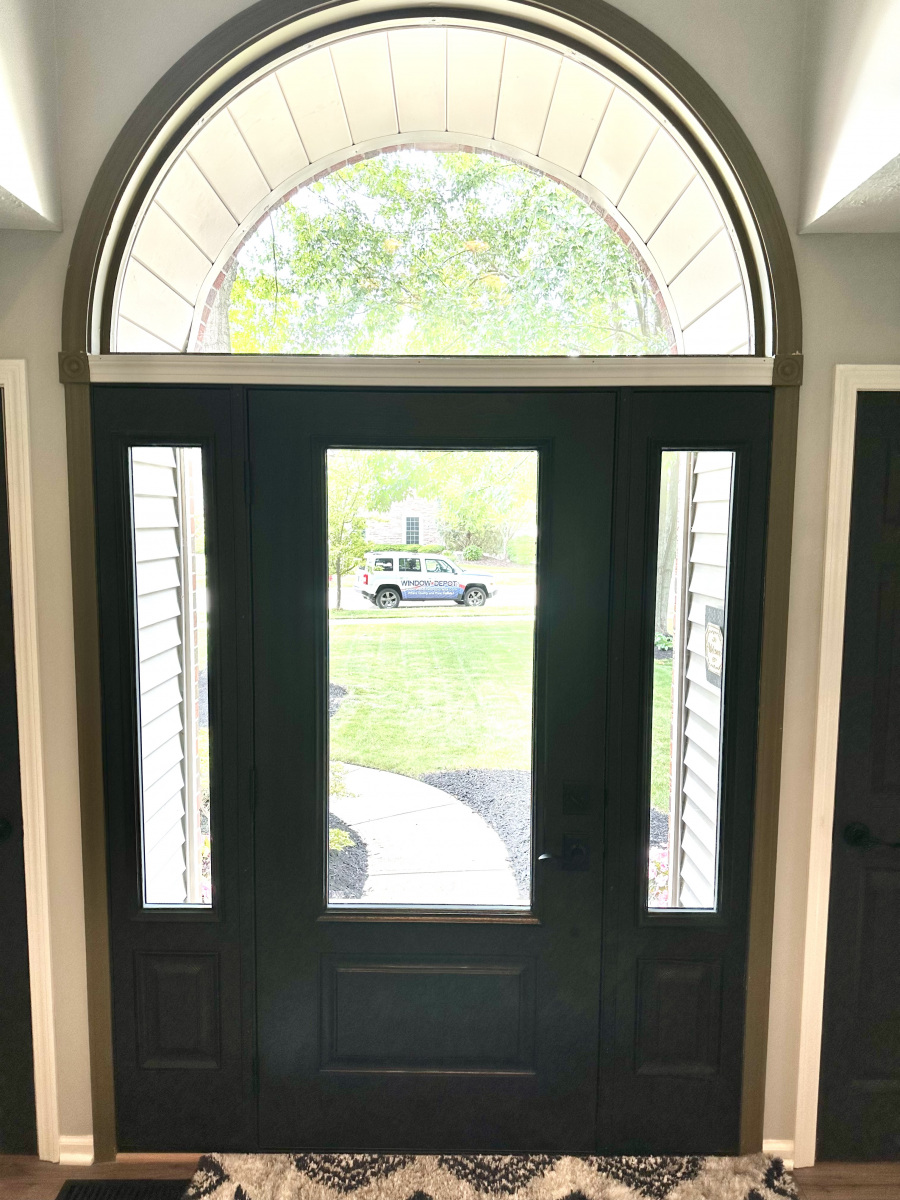 Modern entry door replacement with sidelites, improving Avon home's entrance.