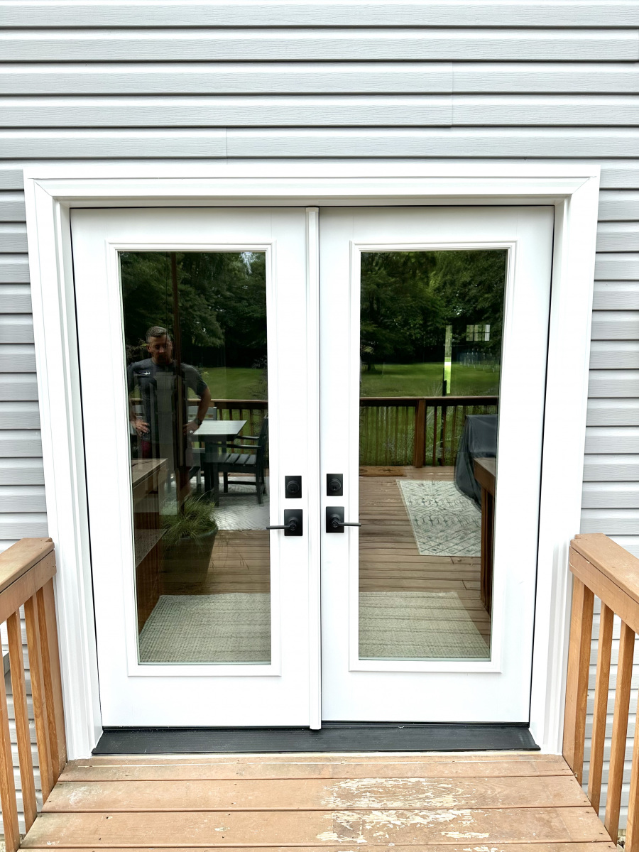 Modern French entry door enhancing the entryway of a Westlake residence.