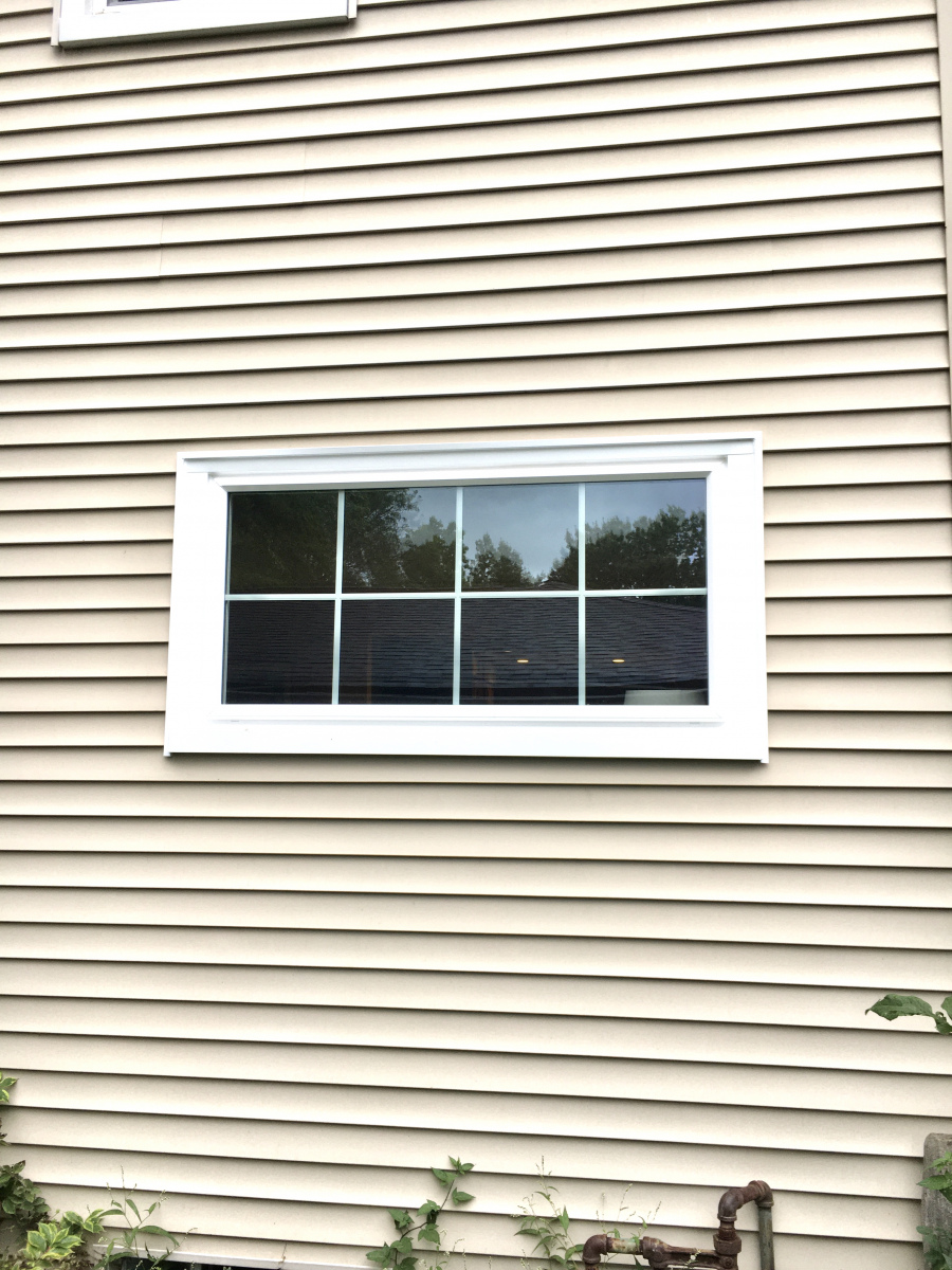 Installation of a window build-out enhancing natural light in the Weissman’s living room.